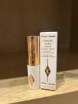 Тональный флюид Charlotte Tilbury Unreal Skin Sheer Glow Tint 1.5 Fair