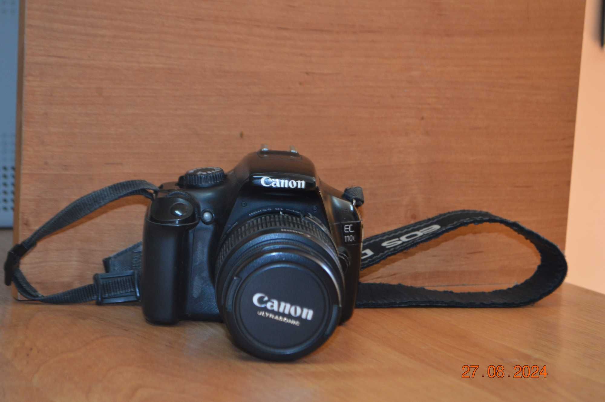 Зеркальный фотоаппарат Canon EOS 1100D с дополнительным объективом