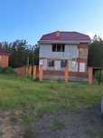 Продам земельный участок с недостроенный коттеджем.