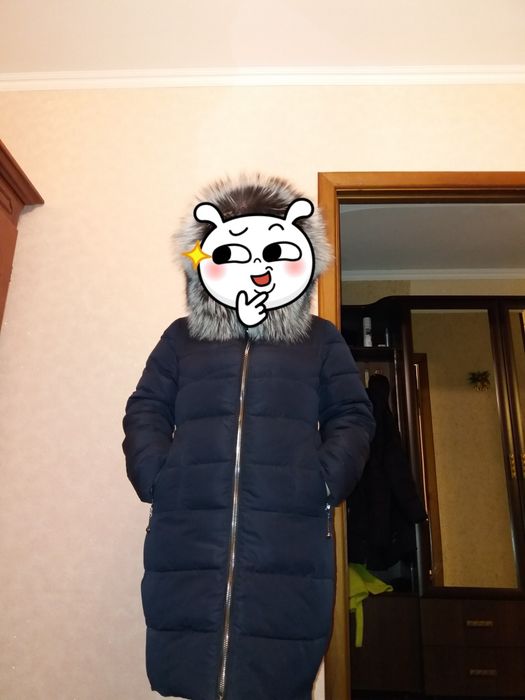 Продам новый пуховик зимний с натуральным мехом чернобурки.