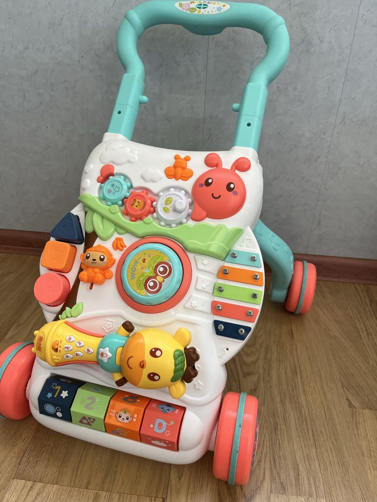 Толокар ходунок с игрушкой