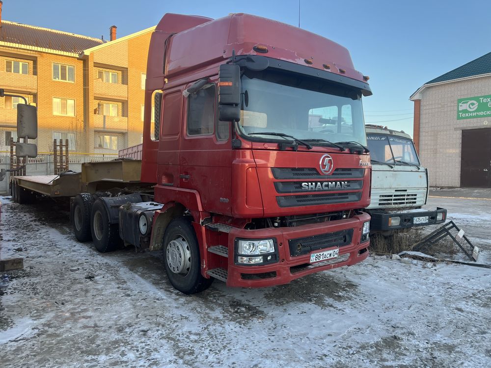 Трал перевозка спецтехники укладчик каток