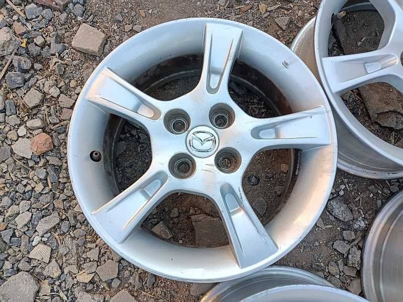Продам оригинальные легкосплавные диски "Enkei" на автомашину Mazda