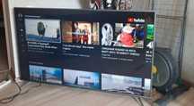 Большой 4К смарт телевизор TCL 140см. С кронштейном.