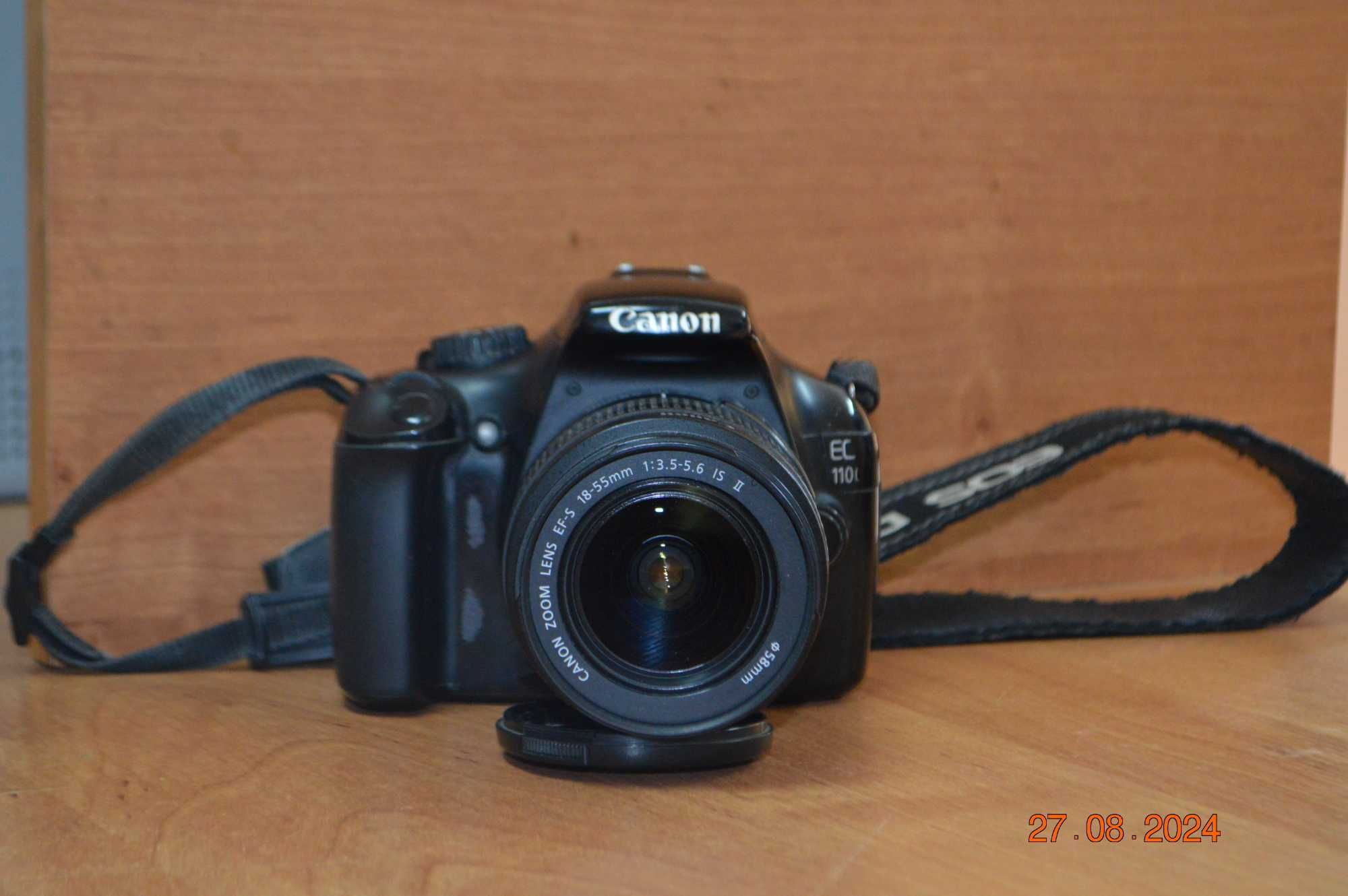Зеркальный фотоаппарат Canon EOS 1100D с дополнительным объективом
