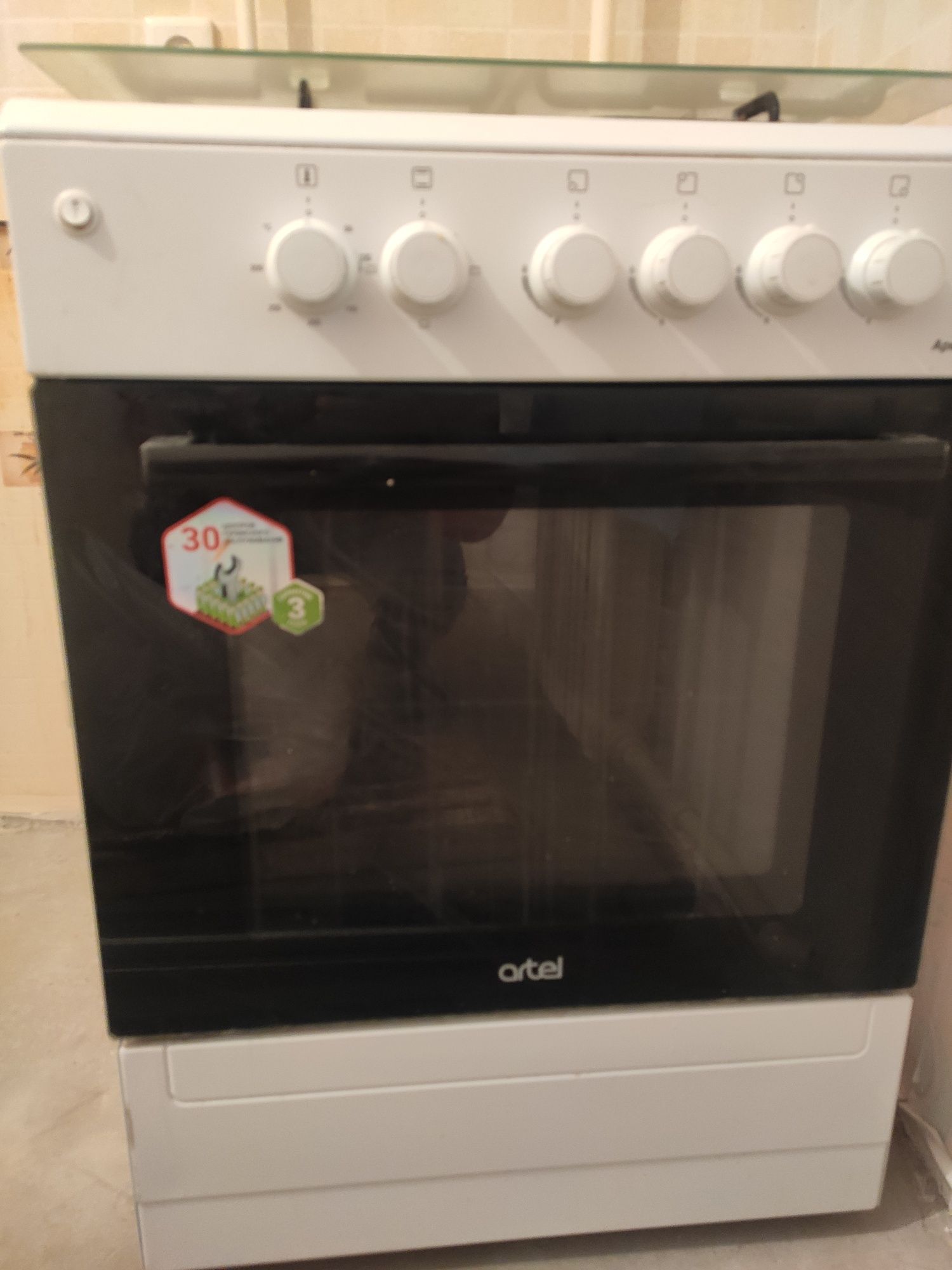 Газовую плиту с электроподжигом artel