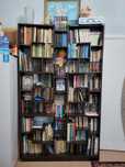 Книжная полка,частично с книгами.
