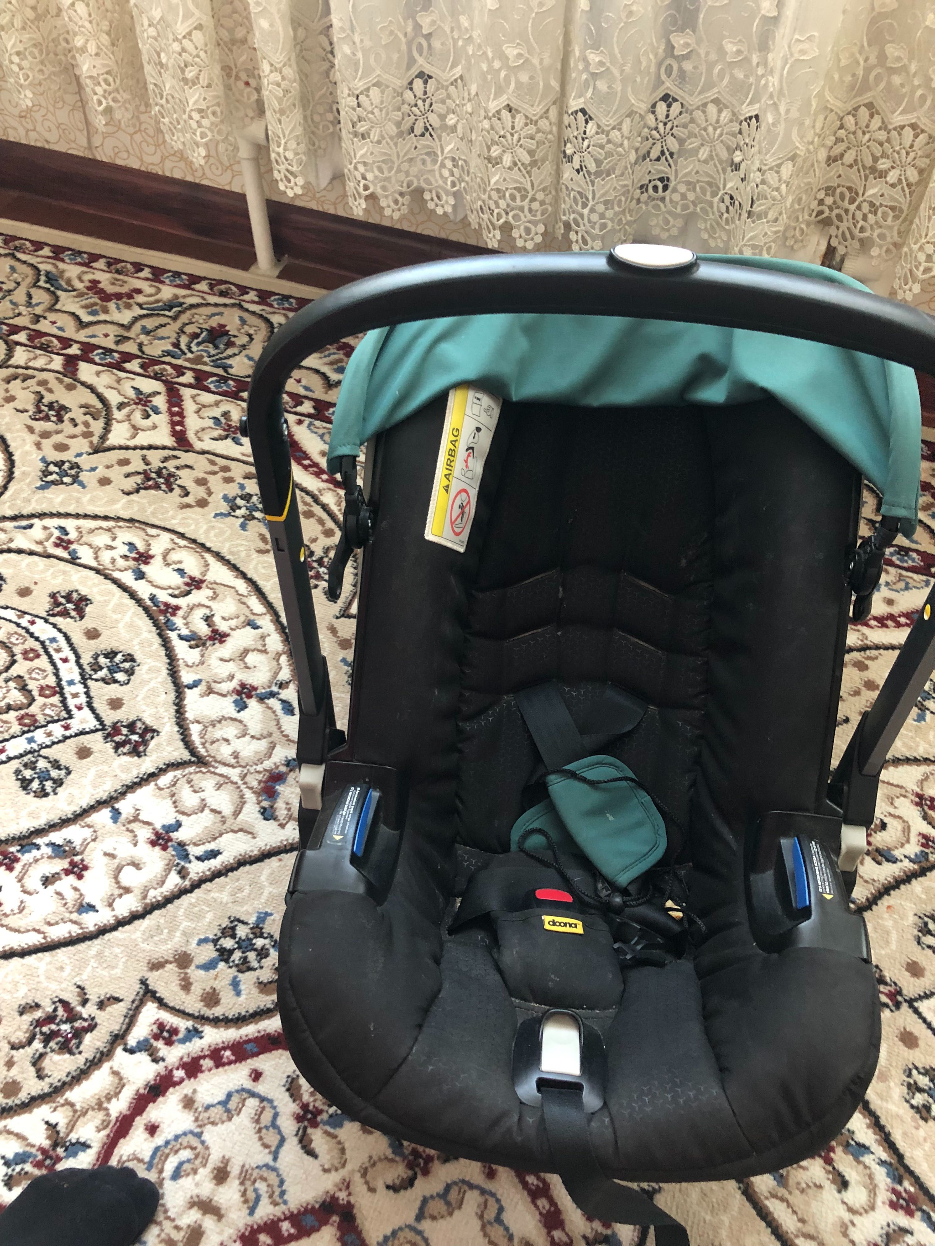 KaspiRED. Коляска-автокресло SimpleParentingDoona+™ цвет Racing Green.