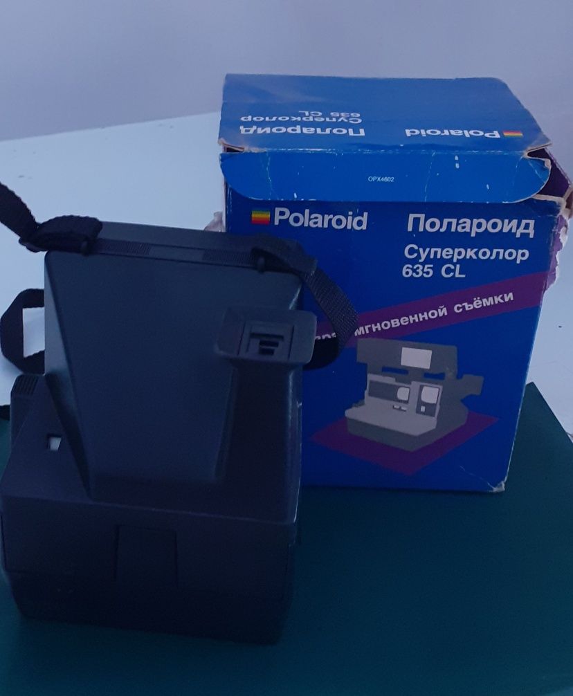 Полароид фотоаппарат.