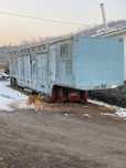 Полуприцеп-коневозка на 11 голов.