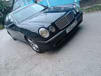 Передний бампер E55 AMG на Mercedes W210