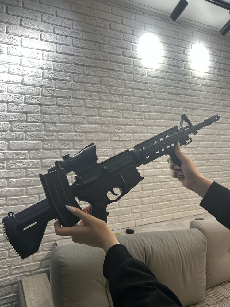 Игрушечный автомат с орбизами