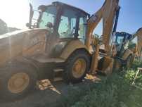 Экскаватор-погрузчик CAT 428, услуги ямобура