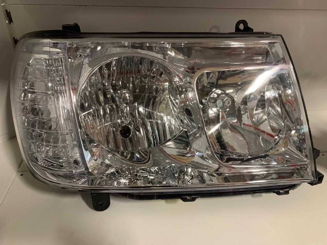 Фара TOYOTA LAND CRUISER 100, 02-07 г.в.