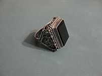 Перстень (филигрань, серебро) с черным камнем.